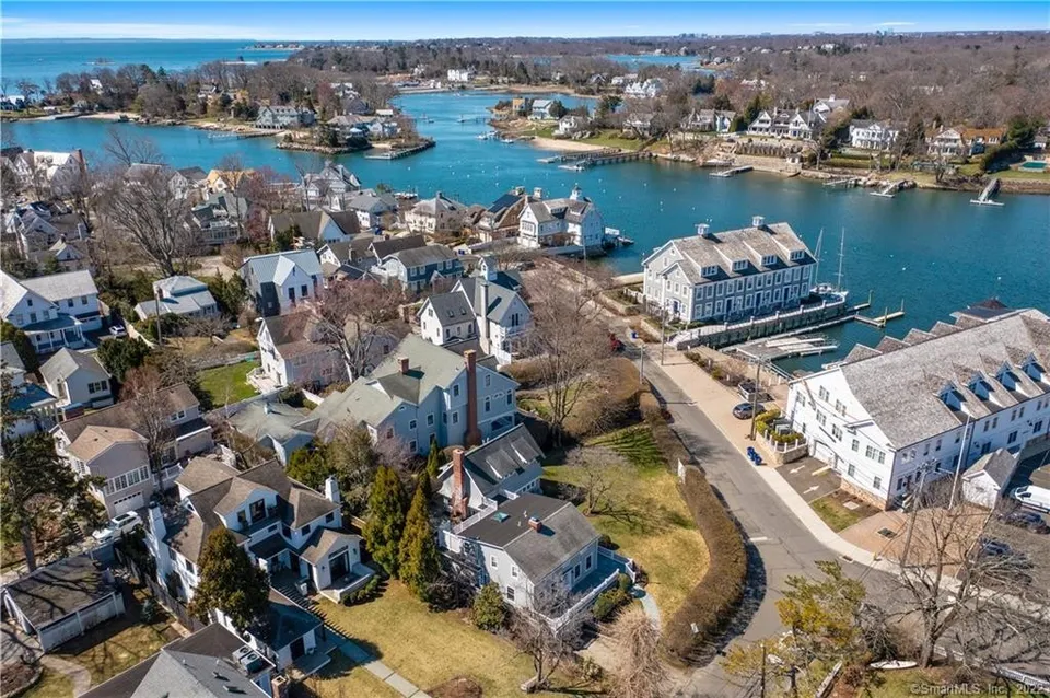 Aerial view of Norwalk waterfront neighborhood with homes, marina, and coastal waterways.