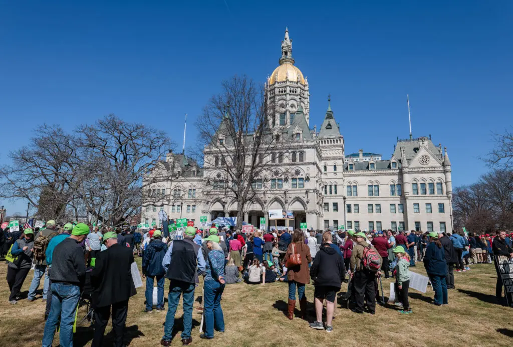 A crowd gathered outside the Connecticut State Capitol building, searching for cheapest places to live in Connecticut.