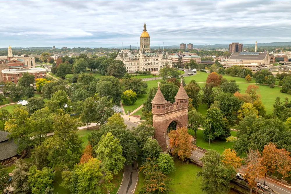 Hartford skyline with State Capitol and Bushnell Park arch.
