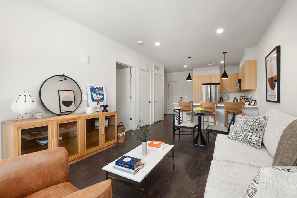 Modern apartment living room with open kitchen.