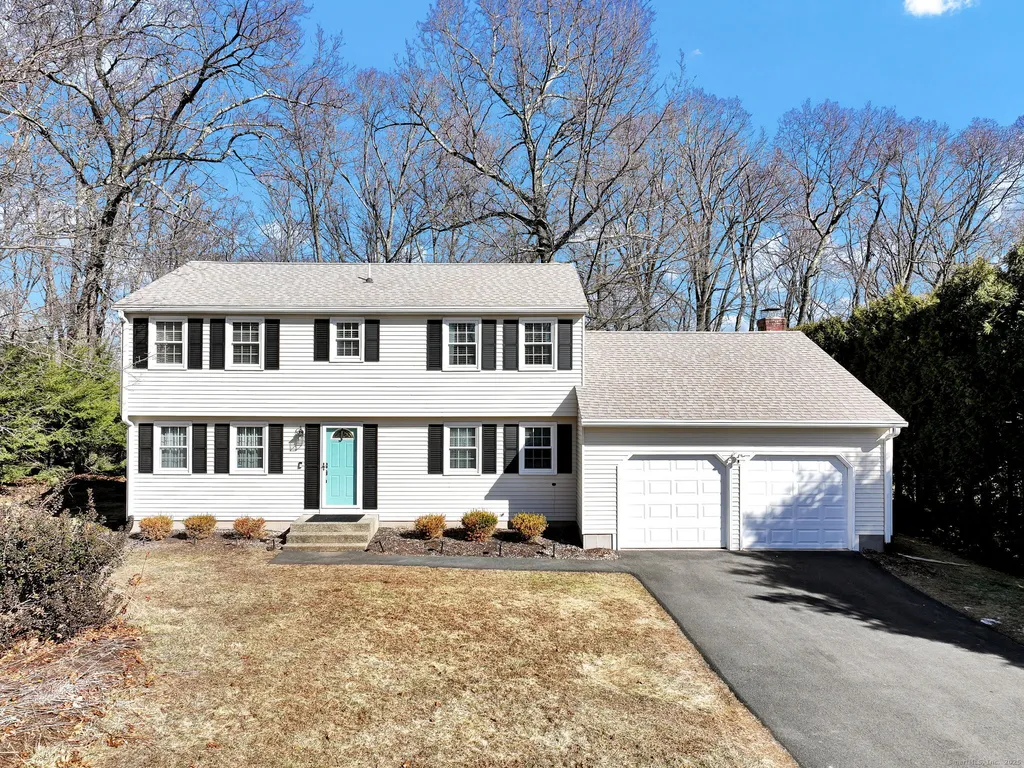 Two-story suburban house with attached garage.
